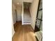 Inviting entryway features wood flooring, a staircase, and a front door with glass panels at 1923 Cassia Aly, Kennesaw, GA 30144