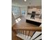 Open kitchen with white cabinets, stainless steel appliances, island, and natural light at 1923 Cassia Aly, Kennesaw, GA 30144
