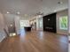 Spacious living room with hardwood floors, modern fireplace, and open to kitchen at 1923 Cassia Aly, Kennesaw, GA 30144