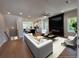 Open-concept living room with a sleek fireplace, modern furniture, and hardwood floors at 1923 Cassia Aly, Kennesaw, GA 30144
