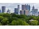 Stunning view of the Atlanta skyline with lush greenery in the foreground at 341 Skylar Se Way, Atlanta, GA 30315