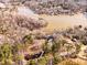 An aerial view displays a vast lake area with several homes dotted among the surrounding trees at 405 Miller Rd, Covington, GA 30014