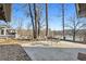 Backyard patio with table, chairs, and lake view at 405 Miller Rd, Covington, GA 30014
