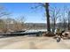 Backyard featuring a fire pit, lake view, and chairs for relaxing at 405 Miller Rd, Covington, GA 30014