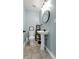 Small bathroom with a pedestal sink, toilet and an overhead light fixture at 405 Miller Rd, Covington, GA 30014