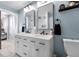 Modern bathroom features a double vanity with marble countertop and stylish black fixtures at 405 Miller Rd, Covington, GA 30014