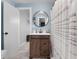 Charming bathroom with wood cabinet and a white marble counter at 405 Miller Rd, Covington, GA 30014