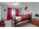 Bedroom with a themed bedspread and a ceiling fan at 405 Miller Rd, Covington, GA 30014