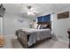 Bedroom features a ceiling fan and a large window with beautiful window treatments at 405 Miller Rd, Covington, GA 30014
