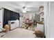 Bedroom with a crib, woodsy wallpaper, white dresser and curtains at 405 Miller Rd, Covington, GA 30014