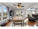 Open concept dining room with hardwood floors and view into living room at 405 Miller Rd, Covington, GA 30014