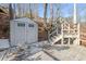 A storage shed is located close to the dock and steps leading to the backyard at 405 Miller Rd, Covington, GA 30014