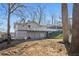 View of home with a large deck and lake views at 405 Miller Rd, Covington, GA 30014