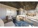 Covered patio with seating area and a ceiling with decorative metal at 405 Miller Rd, Covington, GA 30014