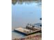 A beautiful view of a lake with a dock and boats at 405 Miller Rd, Covington, GA 30014