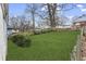 Expansive, green backyard featuring mature trees and a classic wood fence at 960 Byron Sw Dr, Atlanta, GA 30310