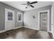 Bedroom featuring hardwood floors, two windows for natural light, and neutral wall color at 960 Byron Sw Dr, Atlanta, GA 30310
