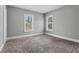 Spacious bedroom with neutral carpet, two large windows providing natural light, and ample space for furniture at 960 Byron Sw Dr, Atlanta, GA 30310
