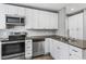 Modern kitchen with stainless steel appliances and ample cabinet space, creating a functional and stylish cooking area at 960 Byron Sw Dr, Atlanta, GA 30310