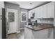 Well-lit kitchen featuring stainless appliances, ample white cabinetry, and a sleek countertop with an undermount sink at 960 Byron Sw Dr, Atlanta, GA 30310