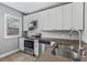 Modern kitchen featuring stainless steel appliances, granite counters, and white cabinets for a bright, appealing space at 960 Byron Sw Dr, Atlanta, GA 30310