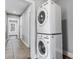 Convenient laundry area featuring a stacked washer and dryer, seamlessly integrated for space-saving efficiency at 960 Byron Sw Dr, Atlanta, GA 30310