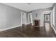 Open living room area with fireplace, hardwood floors, and fresh paint at 960 Byron Sw Dr, Atlanta, GA 30310