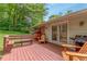 Relaxing back deck with outdoor seating and a grill, ideal for enjoying the outdoors at 1145 Arbordale Dr, Decatur, GA 30033