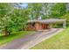 Charming brick home with a covered carport and well-maintained landscaping at 1145 Arbordale Dr, Decatur, GA 30033