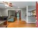 Bright living room featuring hardwood floors, gray walls, and doorway to the kitchen at 1145 Arbordale Dr, Decatur, GA 30033