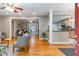 Open-concept living space showcasing hardwood floors, a modern kitchen, and comfortable seating areas at 1145 Arbordale Dr, Decatur, GA 30033