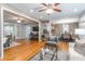 Spacious living room featuring hardwood floors and an open floor plan leading to the dining and kitchen areas at 1145 Arbordale Dr, Decatur, GA 30033
