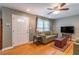 Inviting living room with hardwood floors, large windows, and comfortable seating at 1145 Arbordale Dr, Decatur, GA 30033
