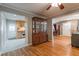 Open-concept living room with hardwood floors and view into kitchen and dining room at 1145 Arbordale Dr, Decatur, GA 30033