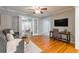 Cozy home office featuring stylish furnishings, hardwood floors, and abundant natural light from French doors at 1145 Arbordale Dr, Decatur, GA 30033