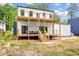 Multi-level deck with outdoor seating overlooking the spacious yard, enhancing the home's appeal at 223 Altoona Sw Pl, Atlanta, GA 30314