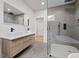 Contemporary bathroom with double vanity, frameless glass shower, and modern fixtures at 223 Altoona Sw Pl, Atlanta, GA 30314