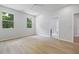 Bright bedroom with hardwood floors, two windows, a ceiling fan, and neutral paint at 223 Altoona Sw Pl, Atlanta, GA 30314