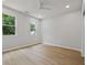Well-lit bedroom with hardwood floors and large windows offering lush green views at 223 Altoona Sw Pl, Atlanta, GA 30314