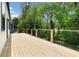 Expansive deck with wood flooring and cable railing overlooking lush greenery at 223 Altoona Sw Pl, Atlanta, GA 30314