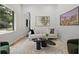 Bright and airy living room features a large window and contemporary furnishings at 223 Altoona Sw Pl, Atlanta, GA 30314