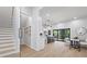 Open-concept floor plan features a modern staircase and bright eat-in kitchen at 223 Altoona Sw Pl, Atlanta, GA 30314