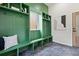 Stylish mudroom with green built-in storage and hexagon tile flooring at 223 Altoona Sw Pl, Atlanta, GA 30314