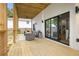 Relaxing covered patio featuring comfortable seating and a view through folding glass doors at 223 Altoona Sw Pl, Atlanta, GA 30314