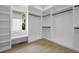 Spacious walk-in closet features custom shelving and a window seat at 223 Altoona Sw Pl, Atlanta, GA 30314