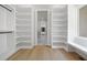 Large walk-in closet with custom shelves and a window seat overlooking the yard at 223 Altoona Sw Pl, Atlanta, GA 30314