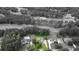 Overhead shot displaying a home with a pool, mature trees, and beautiful golf course views at 240 Huiet Dr, Mcdonough, GA 30252