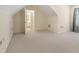 Carpeted bedroom featuring a sloped ceiling and view into the Primary bath at 240 Huiet Dr, Mcdonough, GA 30252