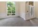 Bright foyer with large windows, elegant trim, and neutral decor creates an inviting entrance at 240 Huiet Dr, Mcdonough, GA 30252