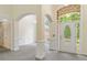 Welcoming foyer with arched doorways, decorative trim, and a stylish front door design at 240 Huiet Dr, Mcdonough, GA 30252